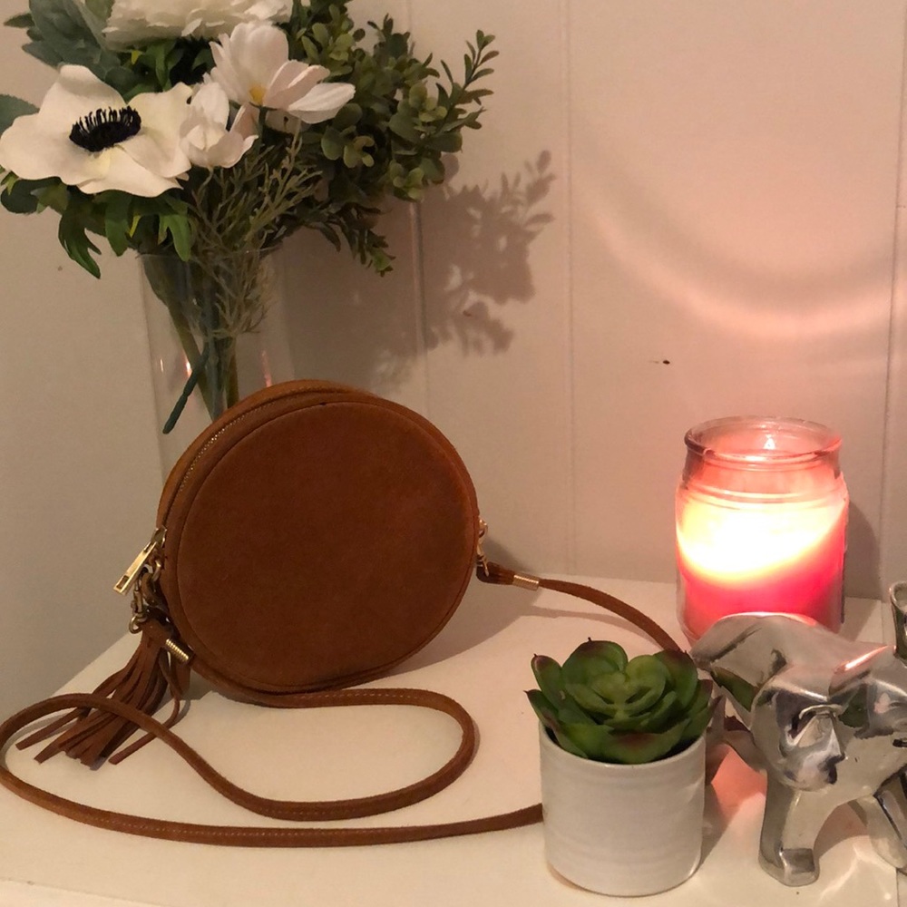 Tan genuine leather satchel with cute tassel.